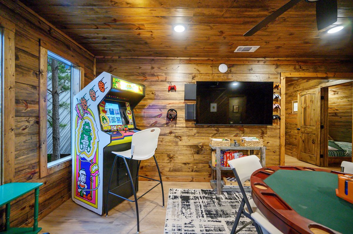 Game room with convertible pool table and arcade