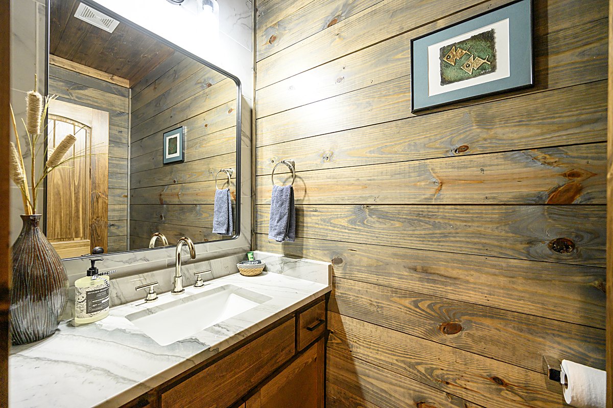 Second master bathroom double vanity with pine walls
