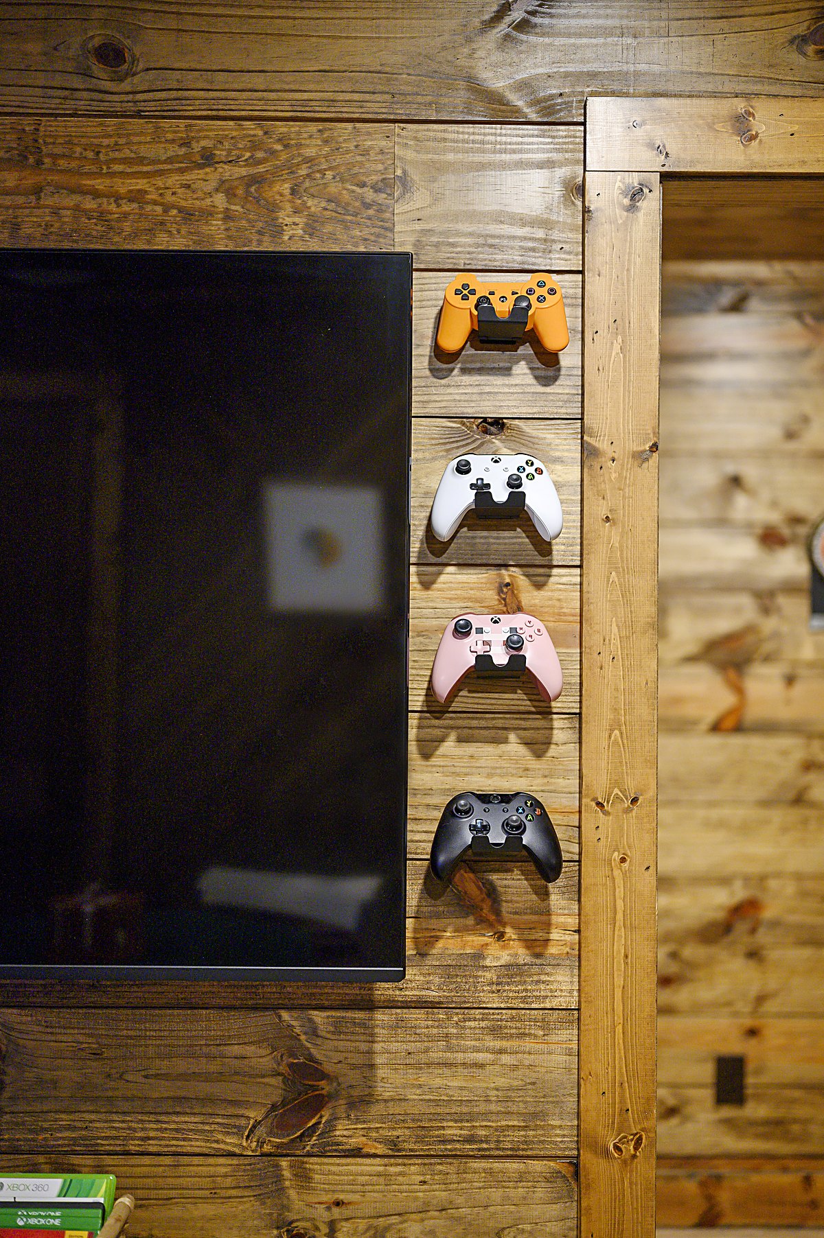 Gaming controllers mounted on the wall